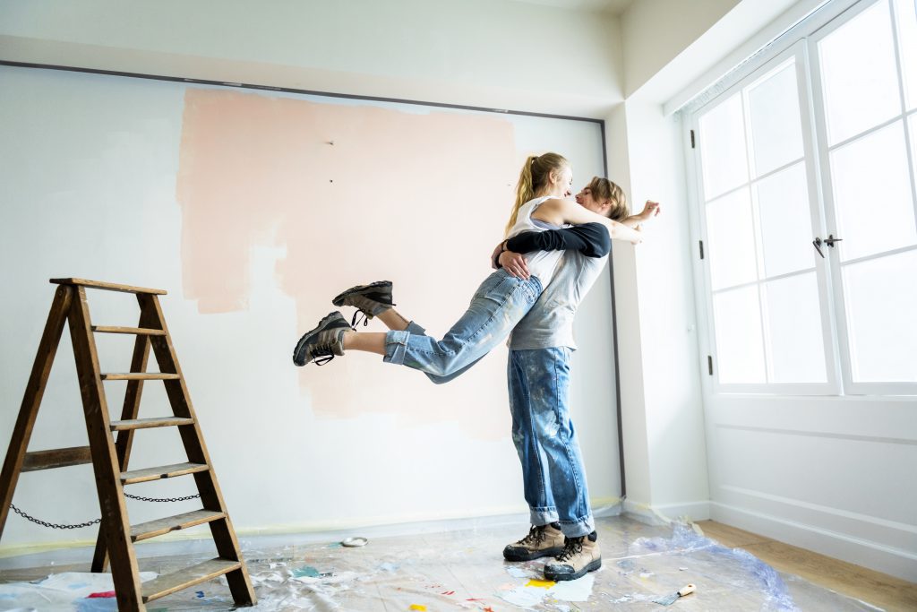 Couple celebrating their decision to renovate