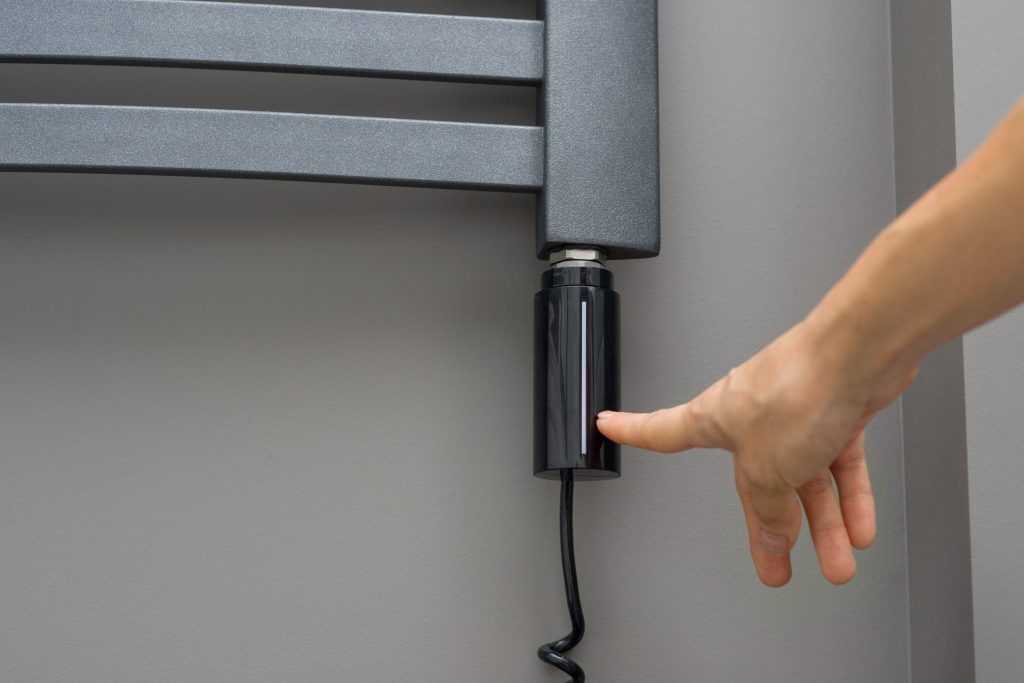 Dark grey Heated towel rack, an expected to be be home renovation trends for Toronto in 2022. 